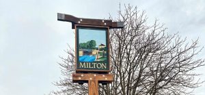 Picture of the top of the renovated village sign on pond green